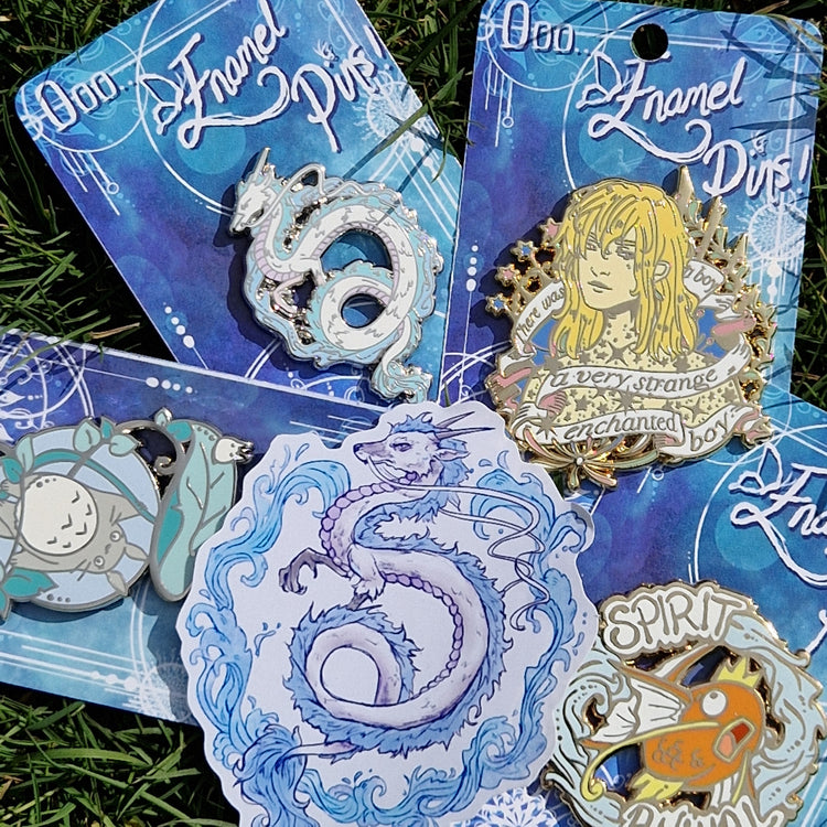 A collection of enamel pins and stickers inspired by anime